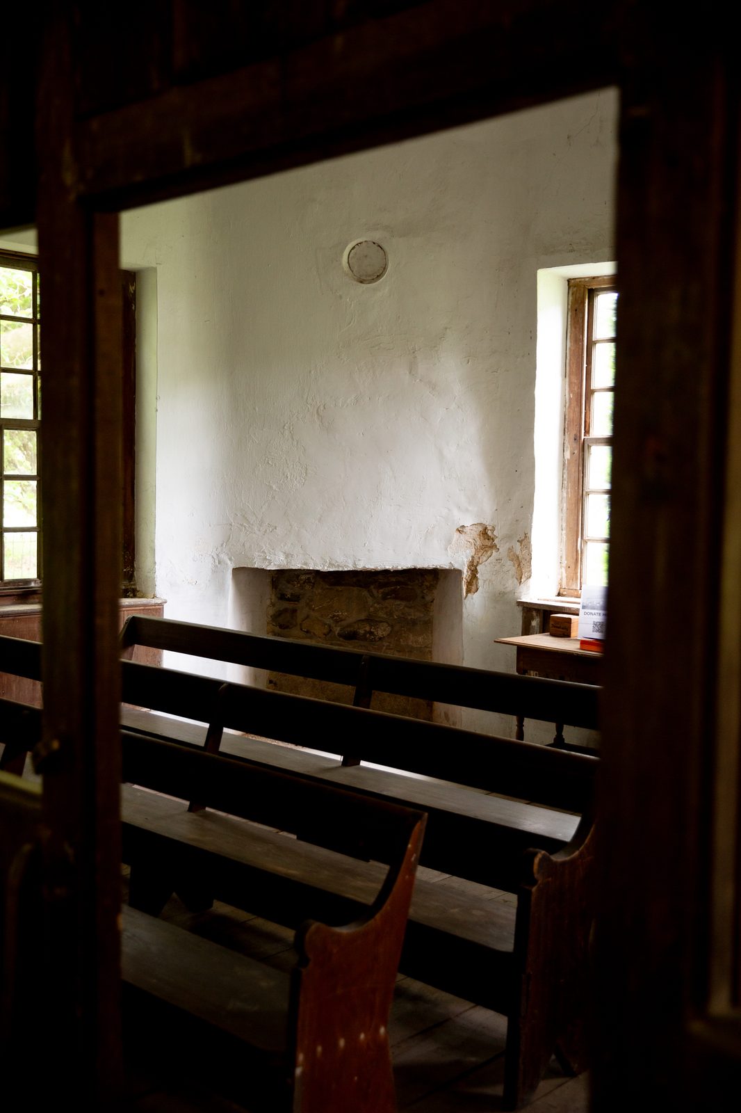 Fireplace seen through the partition doorway